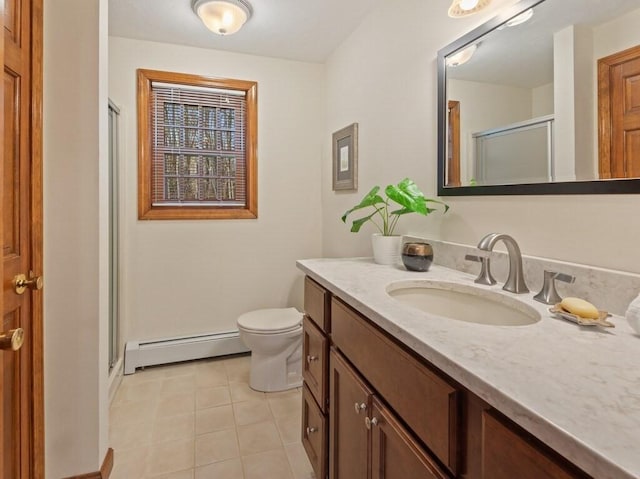 full bath featuring tile patterned flooring, baseboard heating, a shower stall, vanity, and toilet