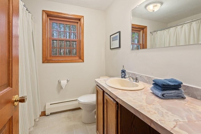 bathroom featuring vanity, a baseboard radiator, baseboards, and toilet
