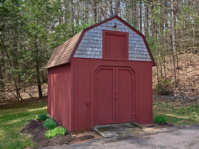view of shed featuring a wooded view