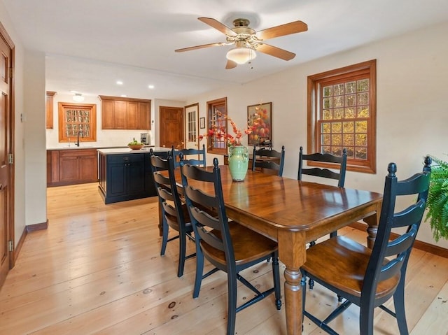 dining space featuring recessed lighting, baseboards, ceiling fan, and light wood finished floors
