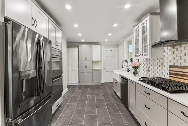 39 Carrlyn Rd, Brockton, MA 02301 - kitchen featuring appliances with stainless steel finishes, wall chimney exhaust hood, ornamental molding, decorative backsplash, and light countertops