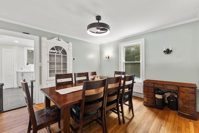 39 Carrlyn Rd, Brockton, MA 02301 - dining area with light wood-type flooring, ornamental molding, and radiator heating unit