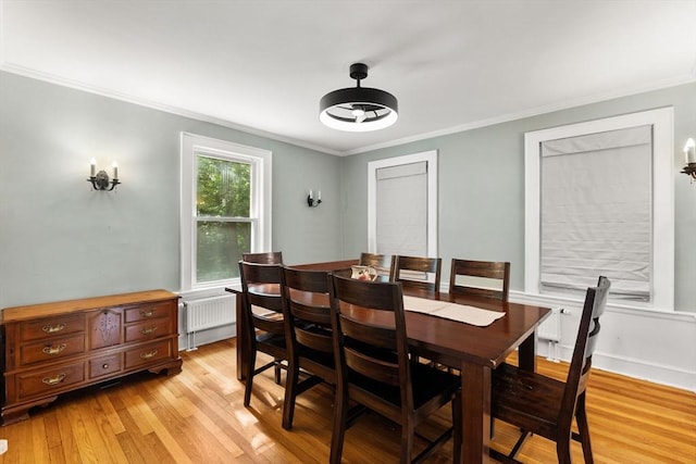 39 Carrlyn Rd, Brockton, MA 02301 - dining room featuring light wood-style flooring, radiator, and ornamental molding