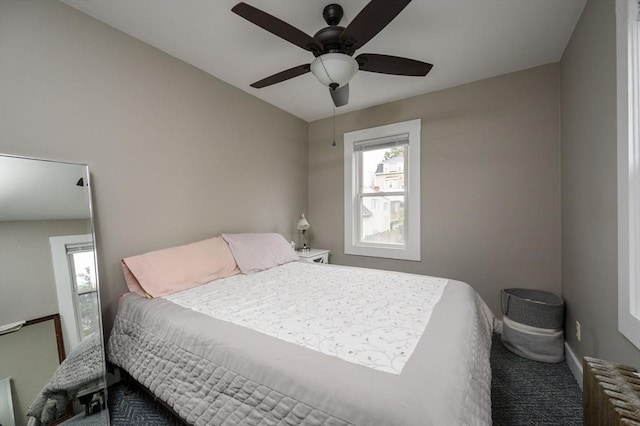 carpeted bedroom with ceiling fan