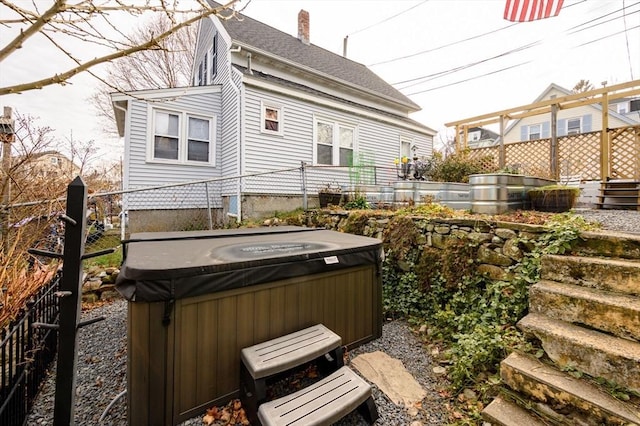 exterior space featuring a hot tub