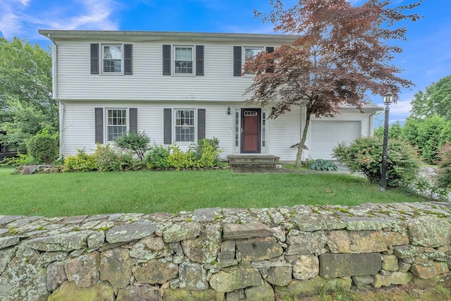 5 Upland St, Auburn, MA 01501 - colonial house featuring a front yard and a garage