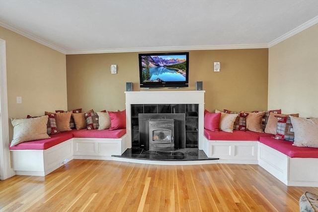 5 Upland St, Auburn, MA 01501 - living area featuring wood finished floors, ornamental molding, and a wood stove