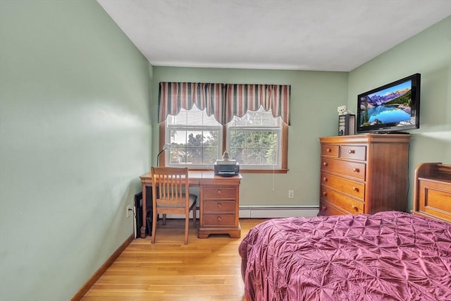 5 Upland St, Auburn, MA 01501 - bedroom featuring baseboard heating and light wood-style floors