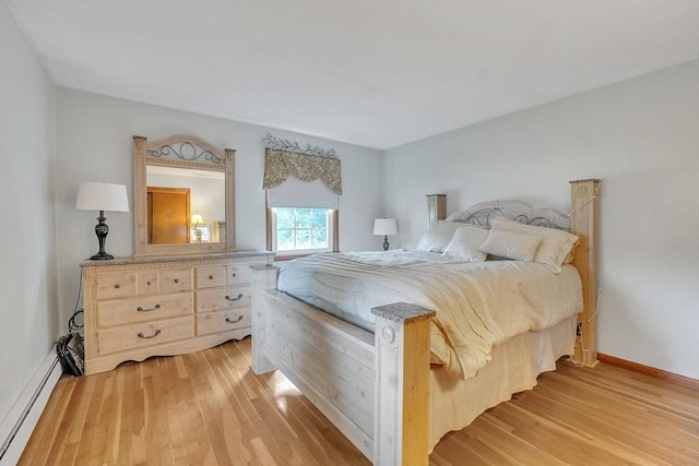 5 Upland St, Auburn, MA 01501 - bedroom featuring a baseboard radiator and light wood-style floors