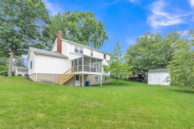 5 Upland St, Auburn, MA 01501 - rear view of house with a sunroom, a storage unit, a chimney, a lawn, and stairs