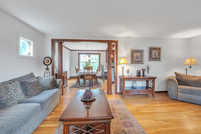 5 Upland St, Auburn, MA 01501 - living room with light wood-style flooring and a chandelier