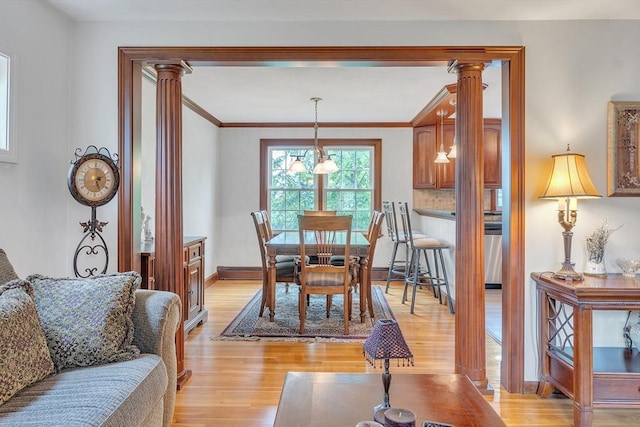 5 Upland St, Auburn, MA 01501 - dining area with ornate columns, light wood-type flooring, and ornamental molding