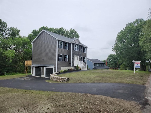 59 Baremeadow St, Methuen, MA 01844 - view of front of home featuring asphalt driveway, a garage, a front lawn, and entry steps