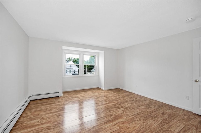 45 W 3rd St Unit 6, Lowell, MA 01850 - spare room featuring baseboard heating and wood finished floors