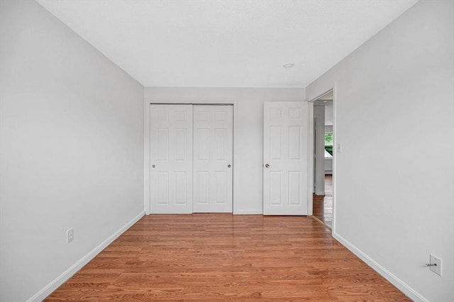 45 W 3rd St Unit 6, Lowell, MA 01850 - unfurnished bedroom with light wood-style floors and a closet