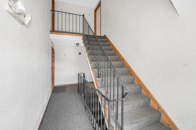 45 W 3rd St Unit 6, Lowell, MA 01850 - stairs featuring baseboards and carpet flooring