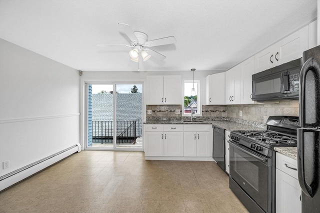 45 W 3rd St Unit 6, Lowell, MA 01850 - kitchen featuring black appliances, a baseboard radiator, decorative backsplash, ceiling fan, and white cabinetry