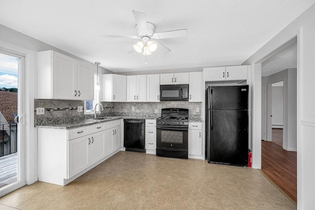 45 W 3rd St Unit 6, Lowell, MA 01850 - kitchen with black appliances, healthy amount of natural light, decorative backsplash, and light stone countertops