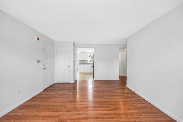 45 W 3rd St Unit 6, Lowell, MA 01850 - spare room featuring light wood-type flooring and baseboards