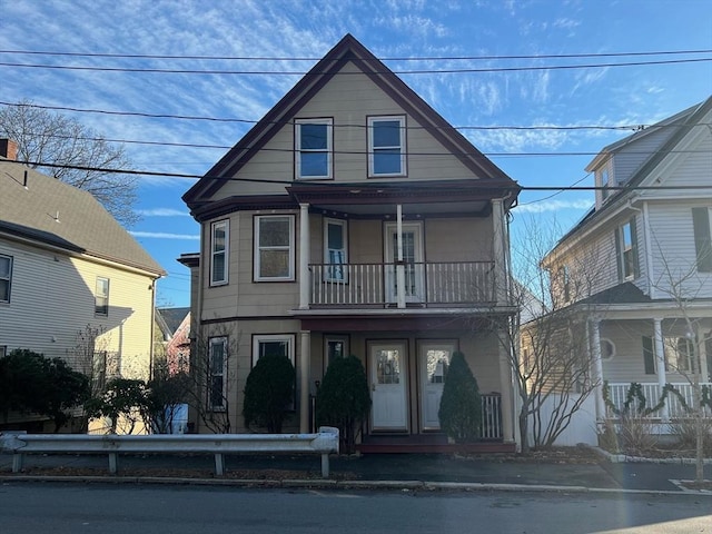 view of front of home with a balcony