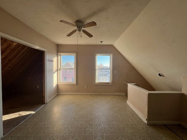 bonus room featuring ceiling fan and lofted ceiling