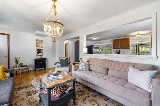 living room with light wood-type flooring and a chandelier