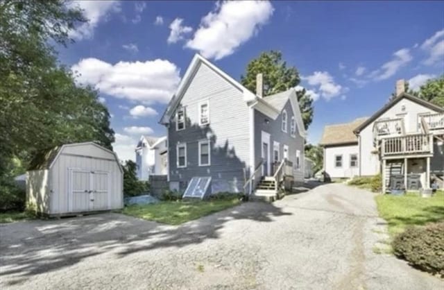 exterior space with driveway and a residential view