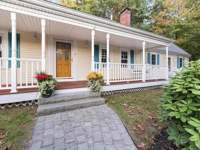 property entrance with covered porch