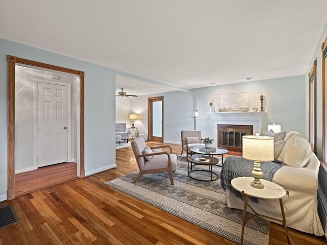 living room featuring a fireplace and hardwood / wood-style floors