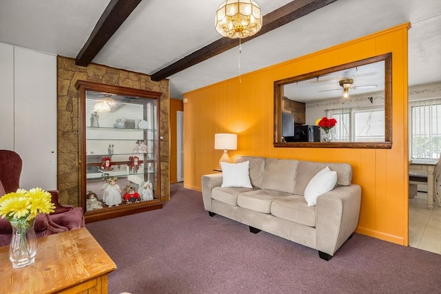 carpeted living room featuring beam ceiling