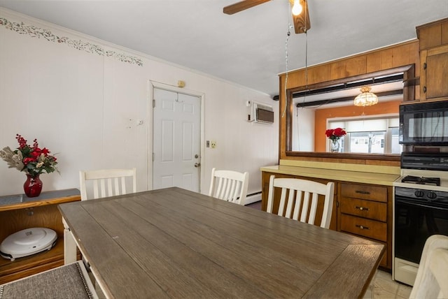 dining area with crown molding, an AC wall unit, and ceiling fan