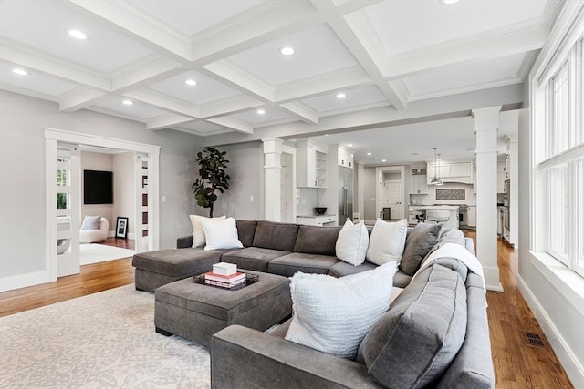 1 Apollo Cir, Lexington, MA 02421 - living area with ornate columns, light wood finished floors, beamed ceiling, recessed lighting, and coffered ceiling