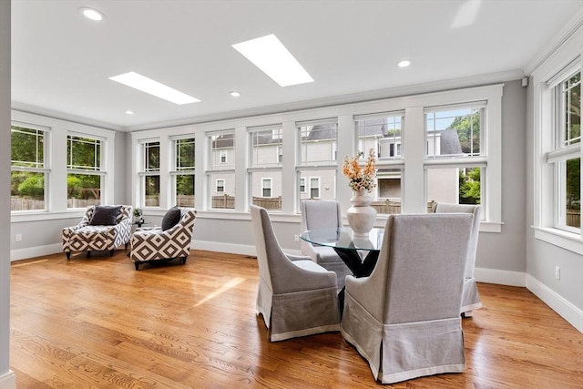 1 Apollo Cir, Lexington, MA 02421 - dining room with a skylight, plenty of natural light, light wood-style floors, recessed lighting, and ornamental molding