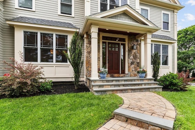 1 Apollo Cir, Lexington, MA 02421 - entrance to property featuring a yard, stone siding, and a shingled roof