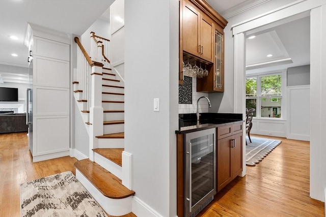 1 Apollo Cir, Lexington, MA 02421 - indoor wet bar with wine cooler, light wood-type flooring, stairway, recessed lighting, and crown molding