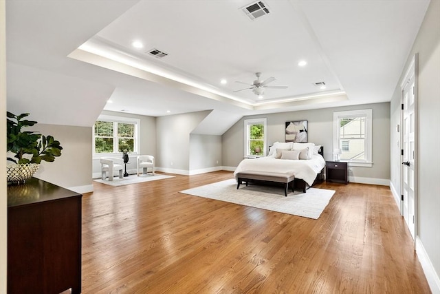 1 Apollo Cir, Lexington, MA 02421 - bedroom with a raised ceiling, light wood-style floors, multiple windows, and recessed lighting