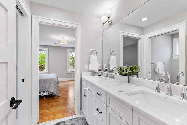 1 Apollo Cir, Lexington, MA 02421 - ensuite bathroom featuring double vanity and baseboards