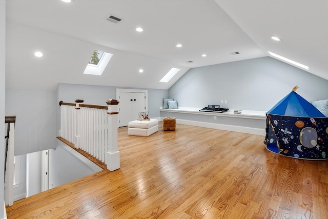 1 Apollo Cir, Lexington, MA 02421 - bonus room with a skylight, vaulted ceiling, wood finished floors, and recessed lighting