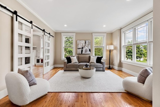 1 Apollo Cir, Lexington, MA 02421 - living room featuring a barn door, crown molding, wood finished floors, and recessed lighting