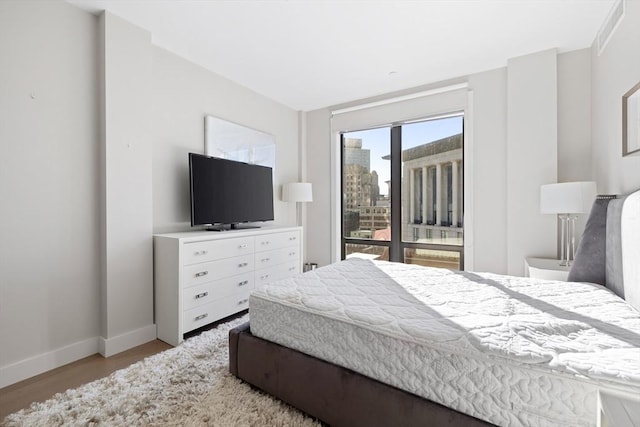 bedroom featuring light wood-type flooring