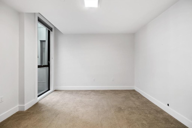 unfurnished room with carpet flooring