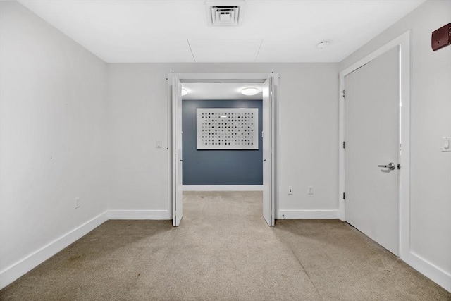 hallway with light colored carpet