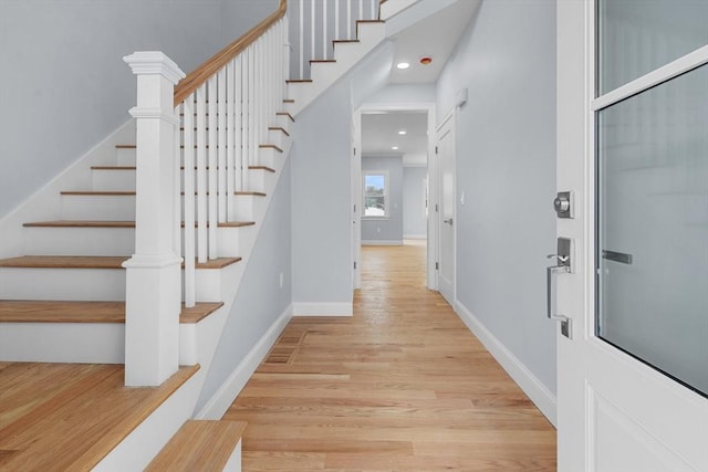 entryway with light hardwood / wood-style floors