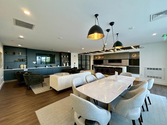 99 Sumner St Unit 305, Boston, MA 02128 - dining room featuring wood finished floors, baseboards, and recessed lighting