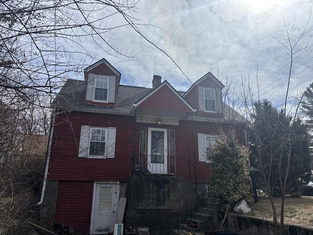 view of front of home with a chimney