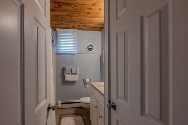 bathroom with vanity, toilet, wood ceiling, baseboard heating, and lofted ceiling