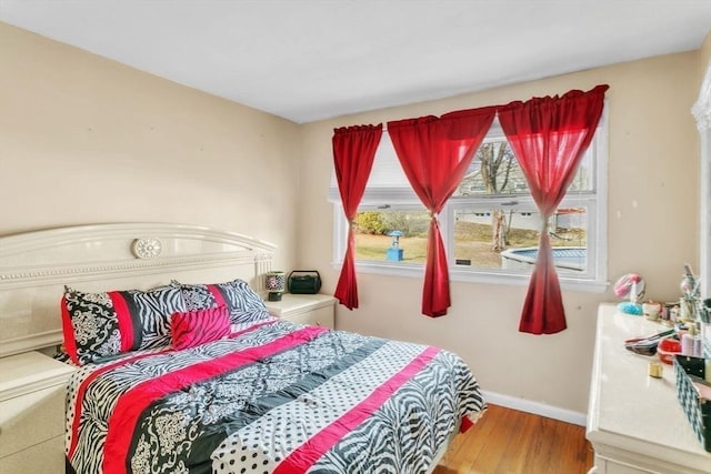 bedroom with wood-type flooring