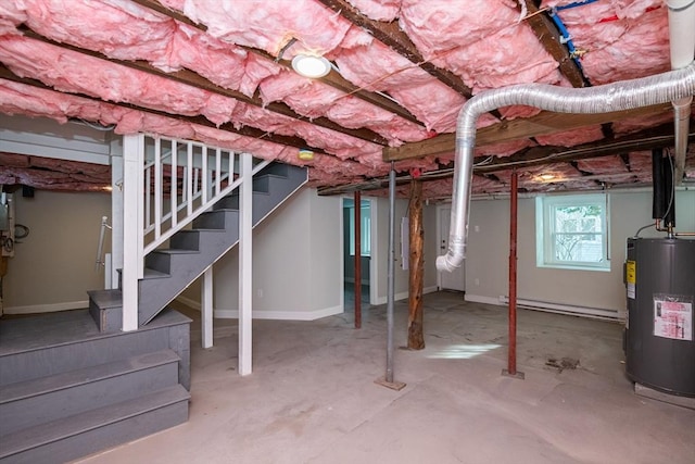 basement featuring a baseboard radiator and water heater