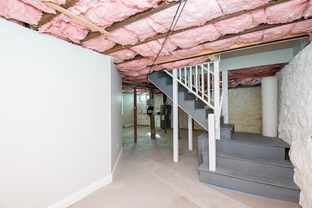 basement featuring electric water heater