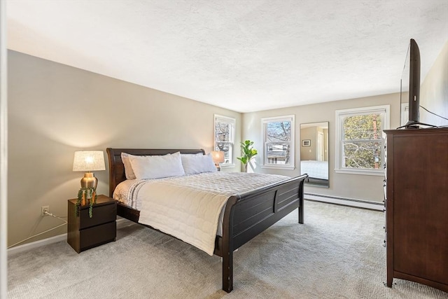 bedroom with a textured ceiling, light colored carpet, baseboards, and a baseboard radiator